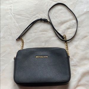 Black Michael Kors Cross body with gold detail